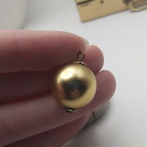 Golden tone orb Edwardian charm bulb